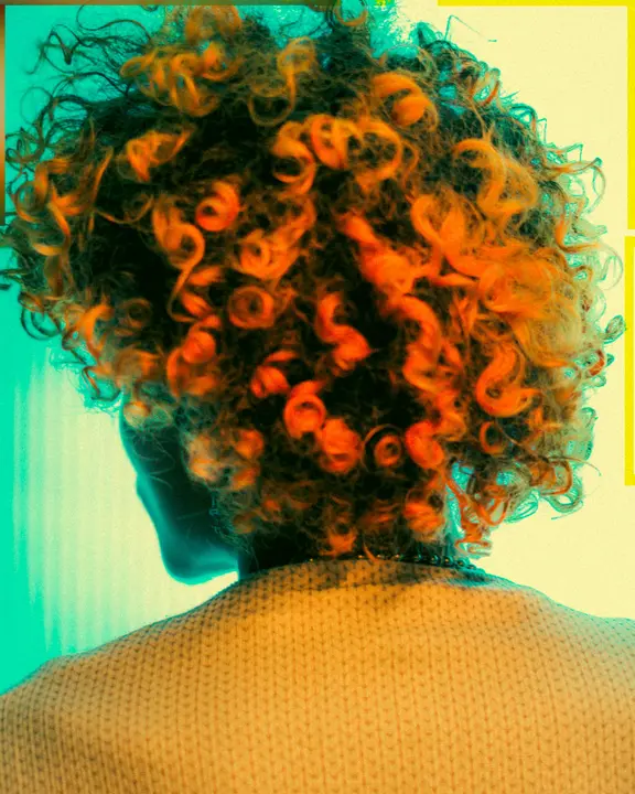 woman with dark curly hair