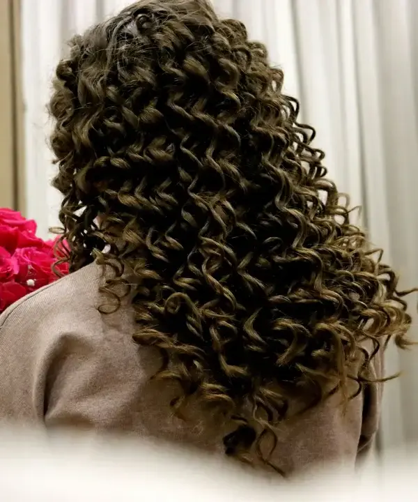 woman with dark curly hair